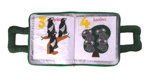 Children's book with pages showing koalas and magpies on a white background